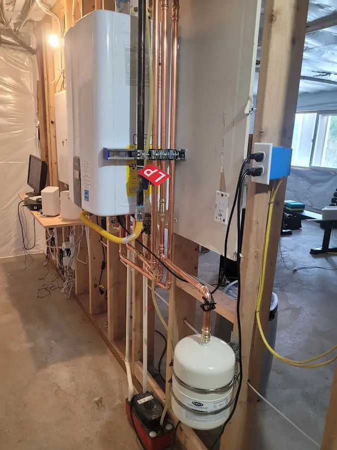 Licensed plumber repairing a kitchen sink in Butner